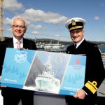 Larry Sullivan from Rogers' Chocolates, and RAdm Nigel Greenwood officially launch the navy chocolate bar.