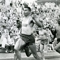 Harry Jerome crosses the finish line at a dual meet with the University of Oregon and Oregon State University, circa 1961.