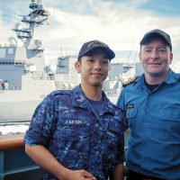Ensign Yusuke Hara meets Commander Clive Butler during a CrossPol exercise while Vancouver transits in company of Japanese Maritime Self-Defense Force ship Fuyuzuki.