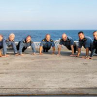 HMCS Charlottetown’s Chiefs (from left to right) CPO2 Kent Ellerbeck, CPO2 Robert Embree, CPO2 Dave Skinner, ship’s Coxswain CPO1 Anthony Greig Bishop, CPO2 Mathew Boniface, CPO2 Kevin Reid and MWO Mike Windsor participate in the 22 Push-up Challenge on the flight deck during OP Reassurance in the Mediterranean Sea. Photo by Cpl Blaine Sewell, Formation Imagery Services