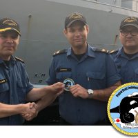 LS Nicholas Dipersio (centre) presents the unit’s new morale patch that he designed to LCdr Tyson Bergmann, Patrol Craft Training Unit (PCTU) Commanding Officer, and CPO2 Eric Pohoney, PCTU Coxswain.