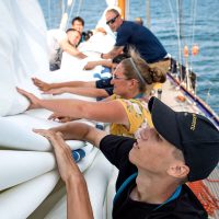 Cadet Jordan Bechard works diligently at flaking the mainsail aboard the training vessel HMCS Oriole while sailing on Lake Ontario during the 2018 Great Lakes Deployment. Photos by MCpl Neil Clarkson, Formation Imaging Services