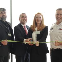 Mark Miller, UNDE; Glenn MacDougall, Acting DGWM; Nicole Schaaf, Office of Disability Management, and Capt(N) Jason Boyd cut the ribbon marking the regional office of Disability Management opening. Photo by Peter Mallett