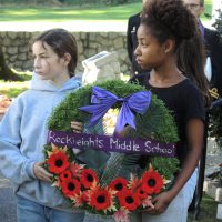 Wreath bearers from Rockheights Middle School take part in a moment of silence. Photo by Peter Mallett, Lookout