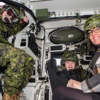 Honorary Lieutenant-Colonel, for the day, Aiden Anderson, along with his sister Courtney Holland and mother Isabella Anderson, experienced army equipment during their visit to Le Régiment de Hull (RCAC), in Gatineau, Quebec, on Dec. 13. Photo by Jay Rankin, Canadian Army Public Affairs
