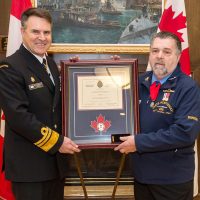 AB (Retired) Allan “Dinger” Bell, a survivor of the 1969 HMCS Kootenay explosion, was presented the Wound Stripe on by VAdm Ron Lloyd, Commander Royal Canadian Navy. Photo by AB John Iglesias, FIS