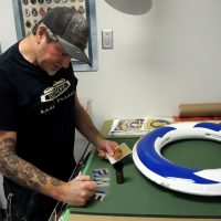 Ryan Yeomans works on a Kisbee ring in his Fleet Maintenance Facility work shop. Photo by Peter Mallett, Lookout