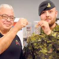 Chuck LaRocque, Chairman of the Royal Canadian Artillery Museum board, and Gunner Kyle Timm of 1 Royal Canadian Horse Artillery, show off a pair of medals awarded to legendary Artillery officer Major-General Tom Strange that were purchased by the Royal Canadian Artillery Museum.
Photo by Jules Xavier, Shilo Stag, DND Canada