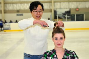 Lynda Lee snips off Lt Malory McDonald’s pony tail