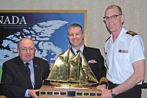 Capt(N) Art McDonald and CPO1 Tom Riefesel accept the J.J. Kinley Award