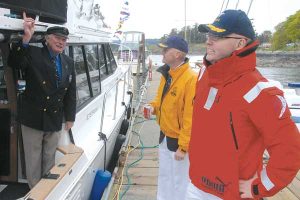 Base Commander and CFSA Commodore greet boat owner Dick Mills