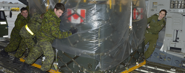 The advance party of the Disaster Assistance Response Team (DART) loads a C177 Globemaster bound for Hawaii at Canadian Forces Base Trenton on November 11, 2013 as Canada awaits recommendations from the Interdepartmental Strategic Support Team (ISST) and Humanitarian Assistance Reconnaissance Team (HART) on how best to assist the people of the Philippines.