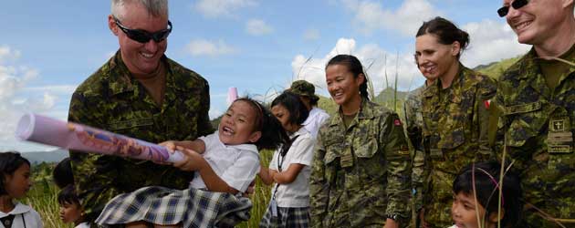 CF members playing with children in the Philippines