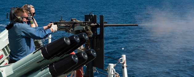 HMCS Regina firing .50 cal machine gun