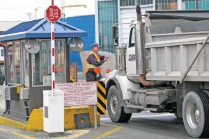 commissionaire checks the identification of a contractor