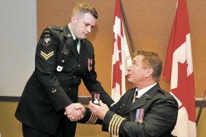 Honorary Colonel Rick Hansen and Cpl Darryl Hansen