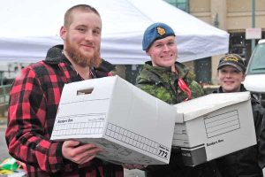 Volunteers prepare documents for the shredder