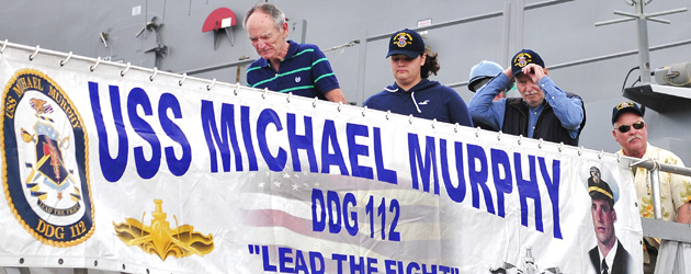 Protecteur family disembarking from USS Michael Murphy.