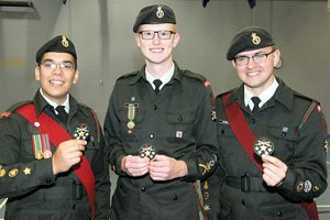 From Left to right: C/MWO Jayden Worth, C/CWO Curtis Whittla (Corps RSM) and C/MWO Tyler Cardinal show their National Star of Excellence Level 4 insignia.