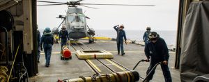 Cpl Brendan McDevitt (right) and other aircrew put away equipment required for loading and unloading MK46 torpedoes during training, in support of NATO Reassurance Measures in the Mediterranean Sea.