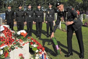 Above: Cadet Chief Warrant Officer Kristan Chung (right) of the British Columbia Regiment lays a wreath at the cenotaph in the Canadian Cemetery at Beny-sur-Mer. Attending the ceremony are, from left: Captain Leah Yauck, C/MCpl Roger Mak, C/Sgt Holly Johnson, C/Sgt Sharon Wong and C/MWO Richard Vo.  Wayne Emde