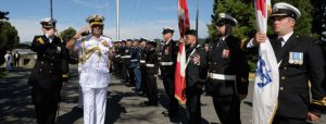 Chief of Naval Staff of the Indian Navy, Admiral Robin Dhowan salutes the color party during the Guard of Honor parade held in his honor at CFB Esquimalt on the 5th of August 2014.