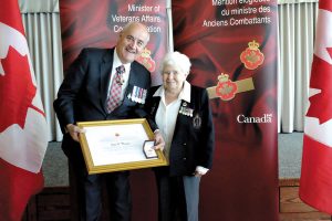 Joan O. Thomas receives the Minister of Veterans Affairs Commendation for her work with the Royal United Service Institute, and her instrumental role in raising two plaques commemorating the service of all Nursing Sister servicewomen during the Second World War, of which Thomas served herself.