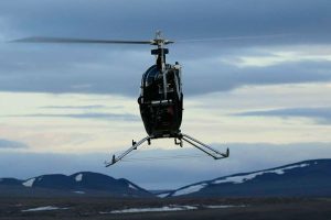 Janice Lang, DRDC photographer Left: The Aphid Unmanned Aerial Vehicle (UAV) soars above the testing ground at Canadian Forces Station Alert. Used for scouting and surveillance, this small, remotely controlled helicopter is capable of flying 100km/h. 