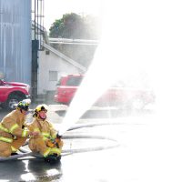 Pat Dunkley and Steve Cullimore take part in an exercise with the Firebrand firefighting vessel during the Great BC Shakeout.