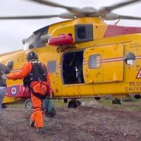 A Cormorant helicopter and Search and Rescue Technicians from 413 Squadron, rescue an injured man from an Island in Cape Breton, Nova Scotia on October 28, 2014.