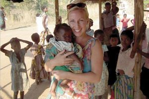 Robyn Los cuddles child at Malawi orphanage
