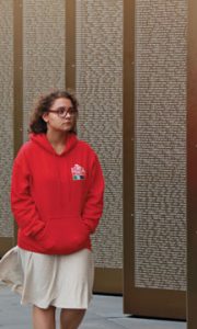 Isabelle Ava-Pointon, 2015 Beaverbrook Vimy prize winner, scans the names of 580,000 men who died in northern France  during the First Word war. The alphabetically engraved names reside on the Ring of Remembrance - Notre Dame de Lorette. 