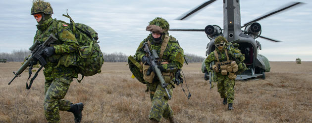 Soldiers disembarking from helicopter