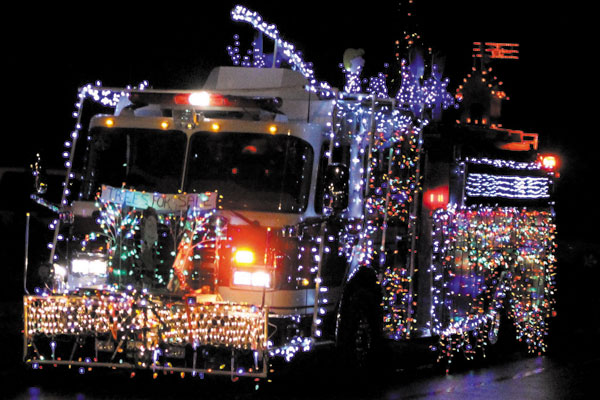 fire truck decorated in christmas lights