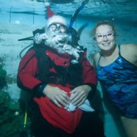 swimmer underwater with santa
