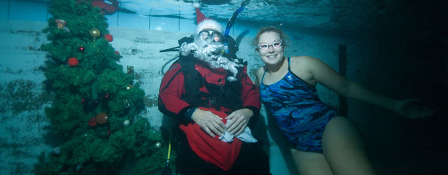 swimmer underwater with santa