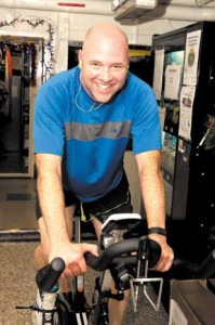 Commander Pascal Belhumeur, Commanding Officer of HMCS Winnipeg, participates in the ship’s Spin-a-Thon fitness challenge during Operation Reassurance in the Mediterranean Sea.