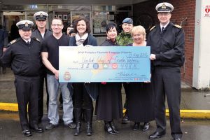 Base Commander Capt(N) Steve Waddell, far right, presents the grand cheque from the base’s GCWCC campaign to the United Way of Greater Victoria.