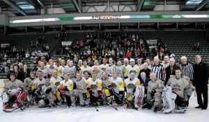 CAF Warriors and former NHL players gather for a group shot following the Abbotsford Heroes Hockey Challenge in April 2013. 