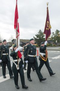 The Canadian Armed Forces Medical Services Banner, the “Princess Royals Banner of our Colonel in Chief” (right) is paraded by the 11 Field Ambulance Royal Banner Color Party past Saanich Municipal Hall.