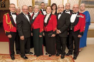 Lieutenant Governor of British Columbia, the Honourable Judith Guichon (front row, third from left) and her husband Bruno Mailloux (front row, second from left) pose with distinguished guests and members of the head table during a dinner commemorating the 100th Anniversary of 13 Field Ambulance, hosted at Government House on March 19.