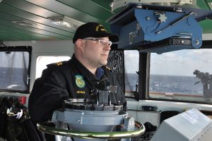 Photo by PA Officer, Op CARIBBE LCdr Jason Bergen, the Executive Officer of HMCS Saskatoon, stands on the bridge during Operation Caribbe.