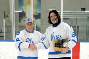 Babcock Blues Team Captain Mark Russell (right) accepts the VISSC (Victoria Class In-Service Support Contract) Hockey Challenge Trophy. The Blues retained their title with a 5-4 shootout win over the RCN Submariners at Wurtele Arena on Apr. 22. PHotos by Peter Mallett, Lookout
