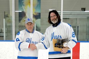 Babcock Blues Team Captain Mark Russell (right) accepts the VISSC (Victoria Class In-Service Support Contract) Hockey Challenge Trophy. The Blues retained their title with a 5-4 shootout win over the RCN Submariners at Wurtele Arena on Apr. 22. PHotos by Peter Mallett, Lookout