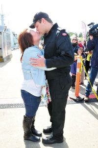 AB Nicholas DiPersio embraces his partner Chi-Ya (Betty) Su during an Operation Caribbe home-coming ceremony at Dockyard’s Y Jetty on April 29.                                      