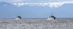 HMCS Edmonton and HMCS Saskatoon sail past Duntz Head as they return to CFB Esquimalt after their deployment to the Eastern Pacific Ocean on Op CARIBBE, on April 29. Photo: LS David Gariepy, MARPAC IS