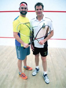 Peter Mallett, Lookout PO1 Timothy King of Fleet School welcomes Colour Sergeant Richard Hall, of the Royal Marines Commando Training Unit, Exeter, England, to Naden Athletic Centre on May 9. Squash players from the base battled their rivals from abroad in a one-day, eight match tournament.