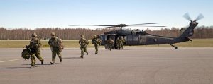 Members of the Op REASSURANCE Land Task Force after completing a tactical evacuation with an American Black Hawk helicopter at Lielvārde Air Base, Latvia on April 21, part of Exercise SUMMER SHIELD. Photo: MCpl Emir Islamagic