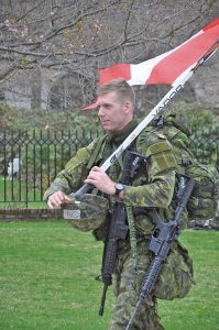 Naval Cadet In Training, Graham Mater of the Royal Military College carries the Canadian flag at the Sandhurst Military Skills competition at West Point, N.Y., April 9.