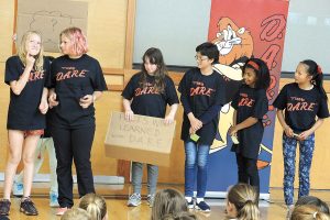 D.A.R.E. participants act out a skit for the rest of the group.